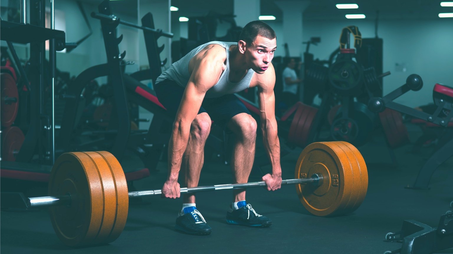 Man performs a traditional deadlift