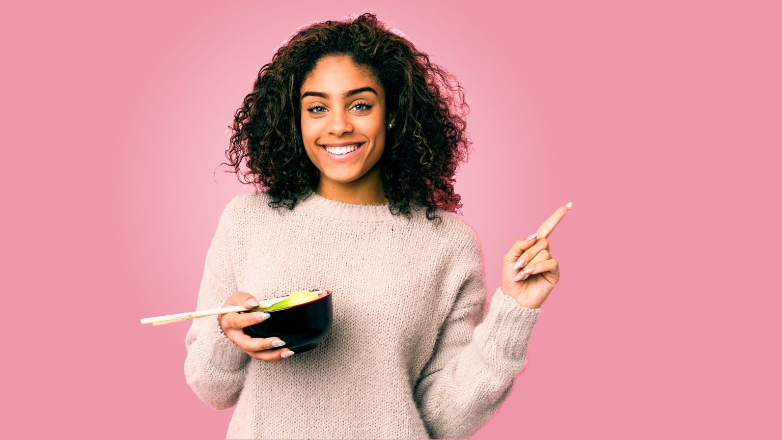 photo - A woman eats a small meal. Intermittent fasting is a diet pattern with 2-3 fasting days per week, made up of small meals totaling 500-600 calories.