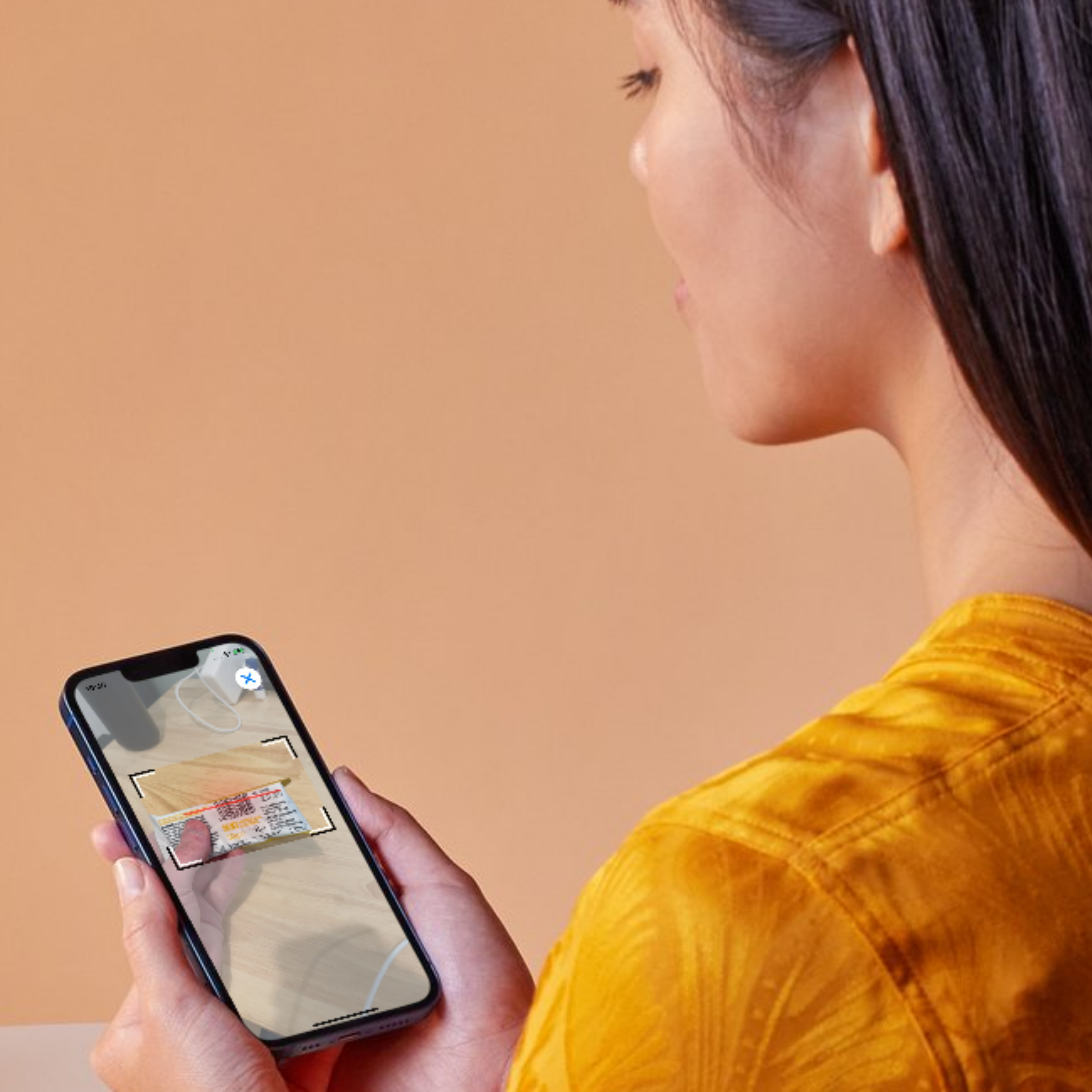 photo - A woman uses the Gym Geek calorie tracker app to scan a barcode. You can use the Gym Geek app to create a calorie deficit weight loss plan and track your progress over time.